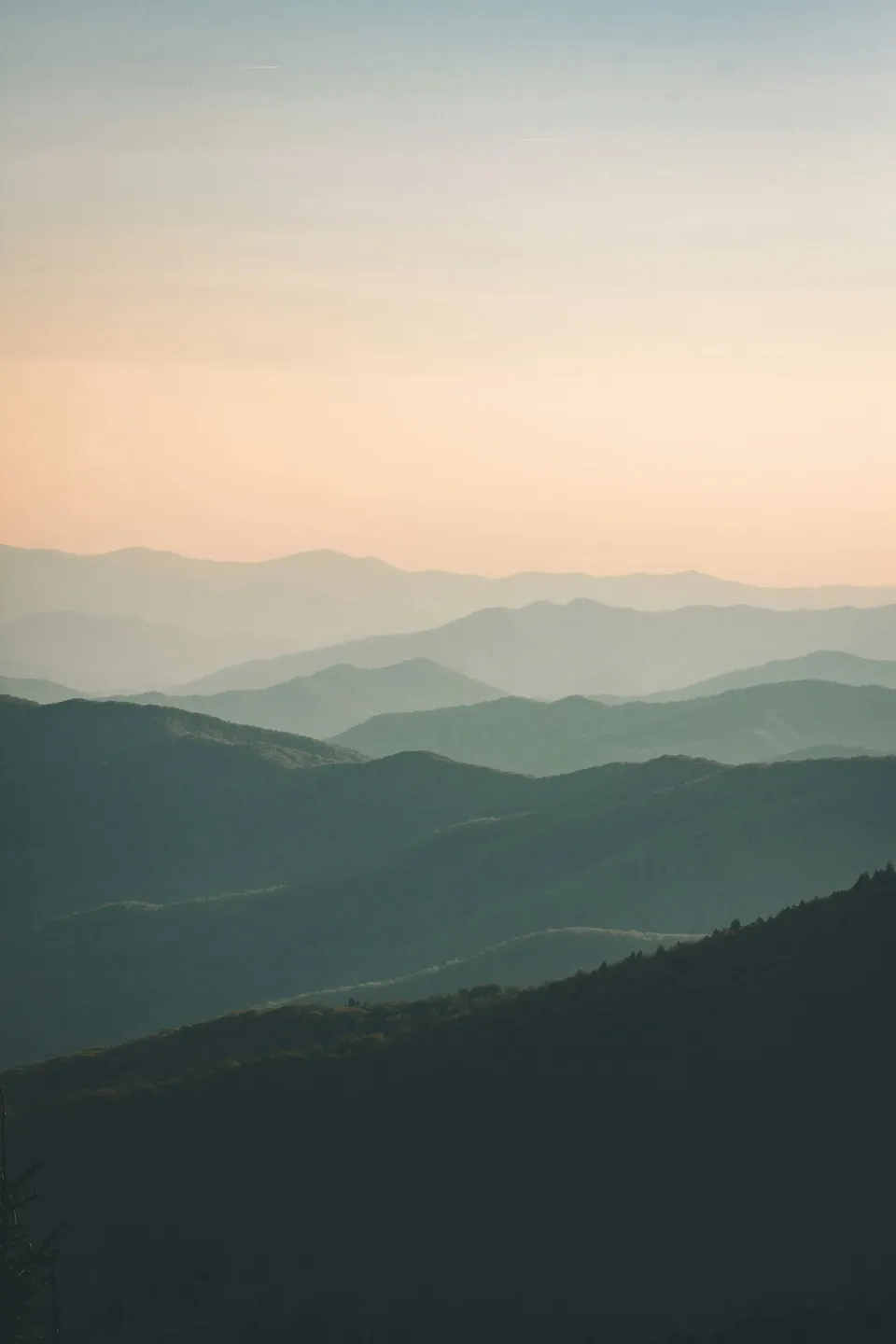 Layered mountain ridgelines at dawn