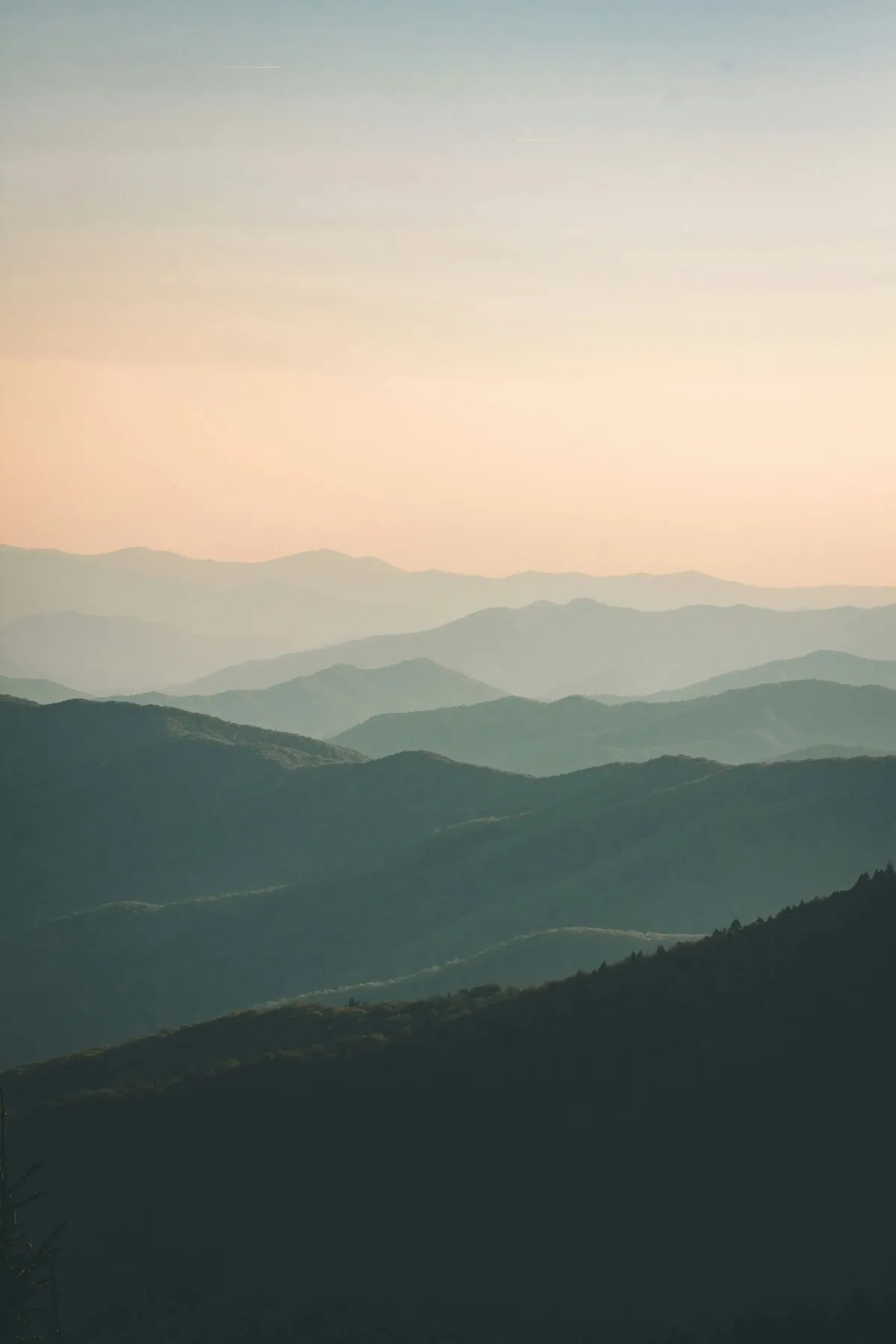 Layered mountain ridgelines at dawn